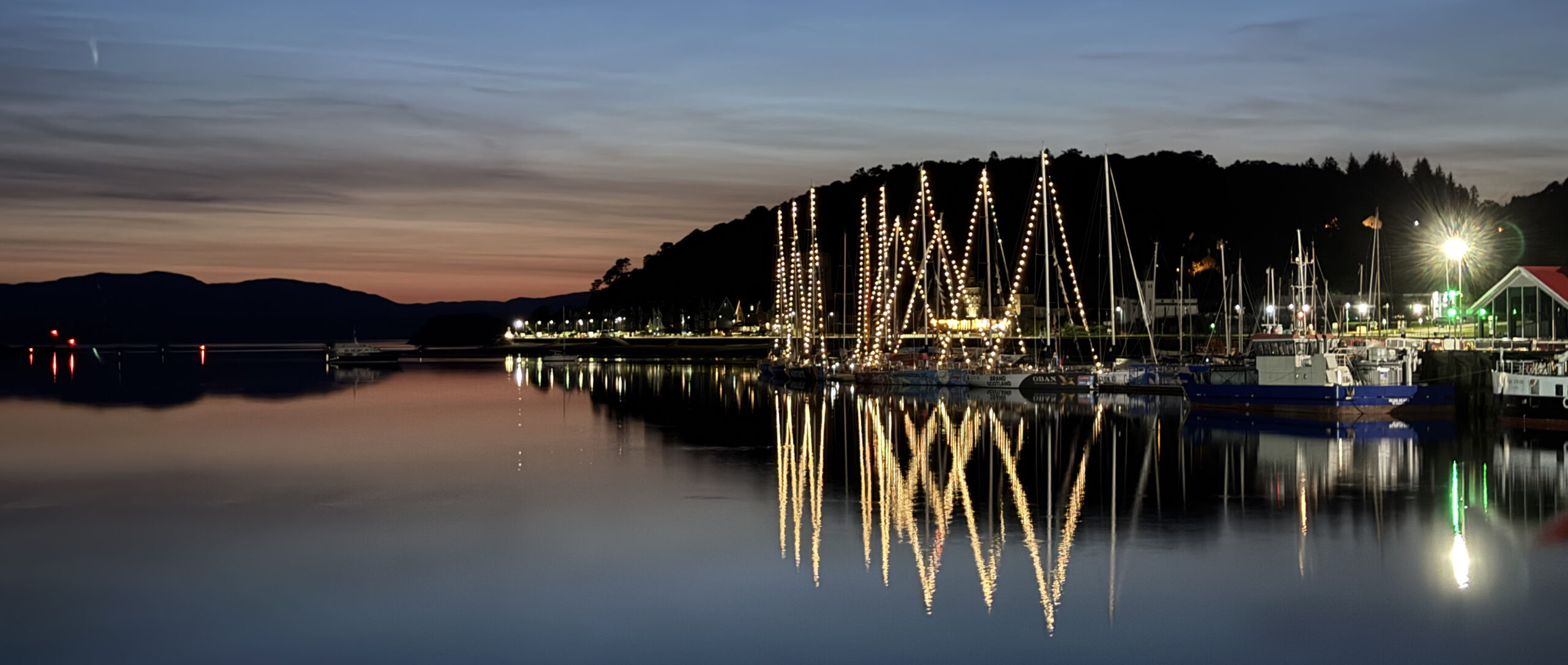 Boats at night with lights.